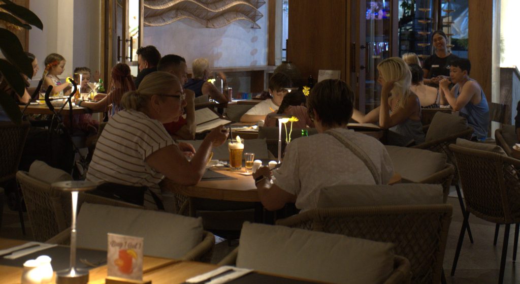 Family enjoying a meal at Mozzarella restaurant for families in Legian, Bali